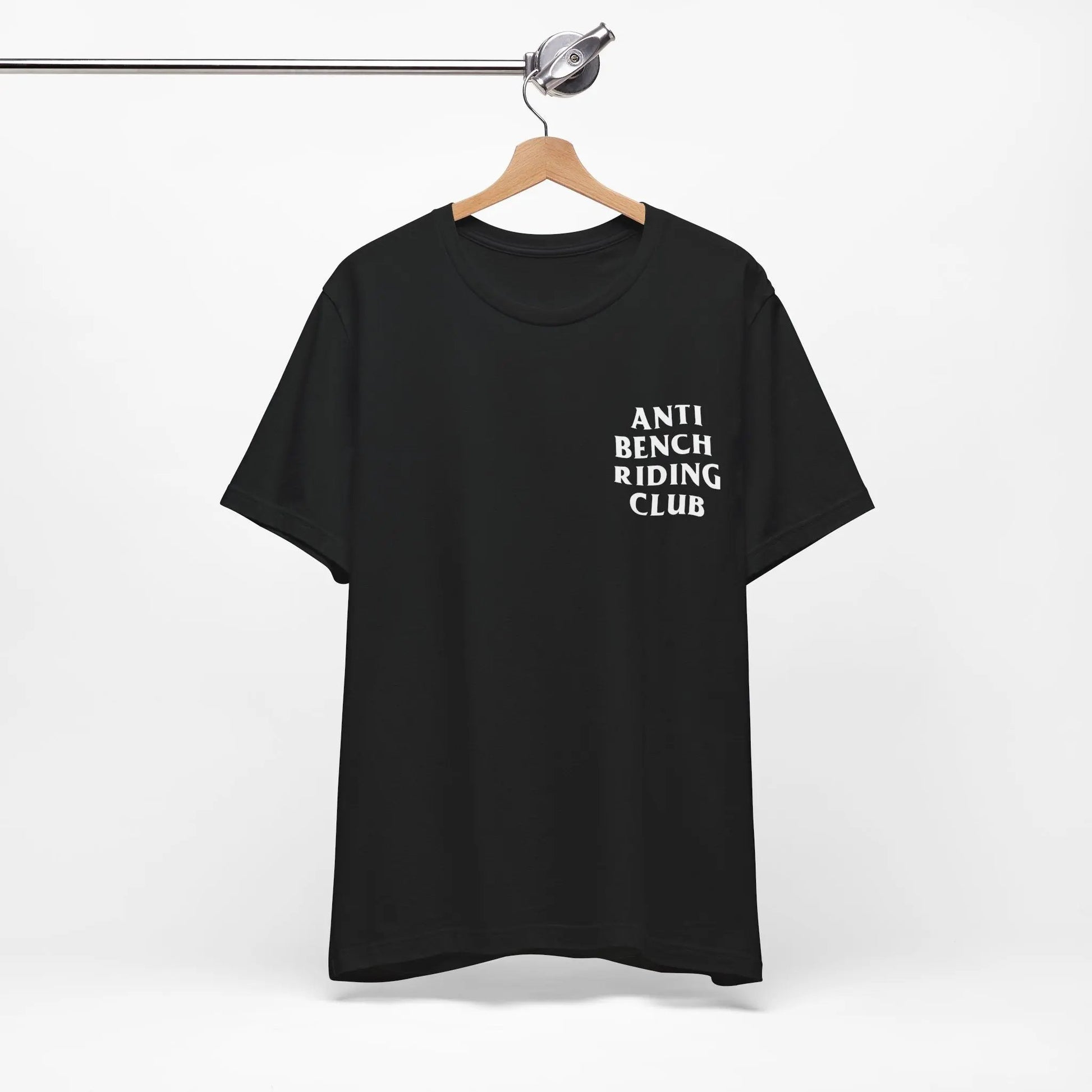 Black t-shirt with 'ANTI BENCH RIDING CLUB' text on a hanger against a white background