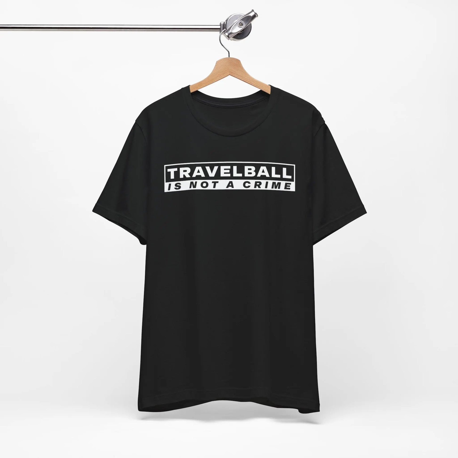Black t-shirt with 'TRAVELBALL IS NOT A CRIME' text on a hanger against a white background