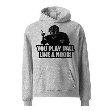 A gray oversized hoodie with a graphic print of a baseball player and the text 'YOU PLAY BALL LIKE A NOOB!' on the front.
