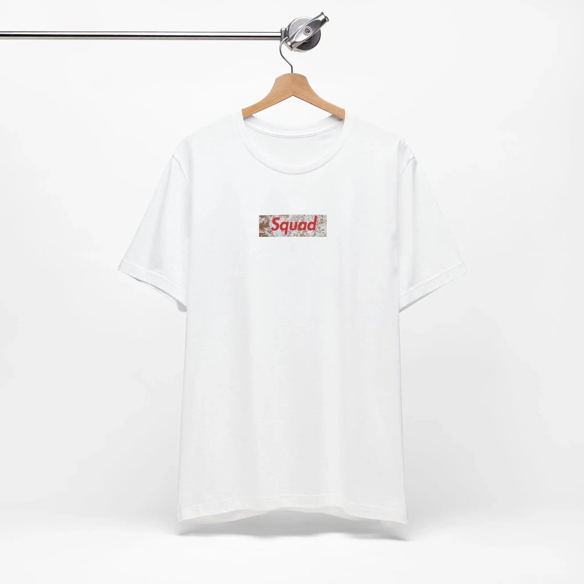 White t-shirt with a red and black logo on a hanger against a white background
