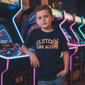 Professional baseball lifestyle photoshoot with Clutch Like Altuve Youth Tee in arcade